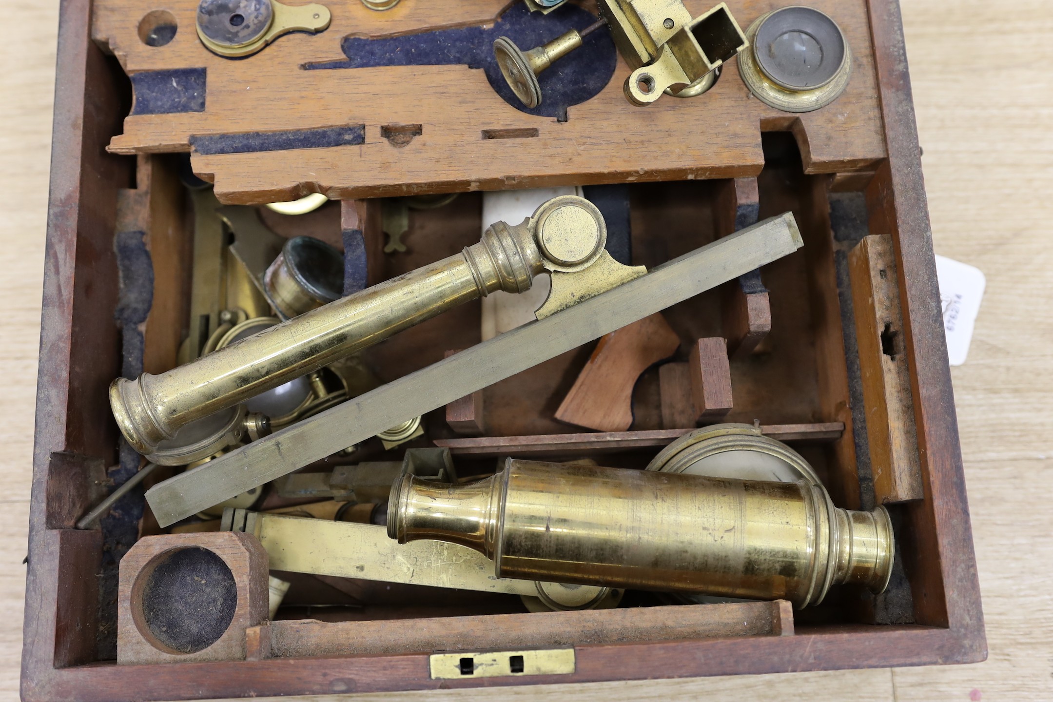 A 19th century cased brass monocular microscope